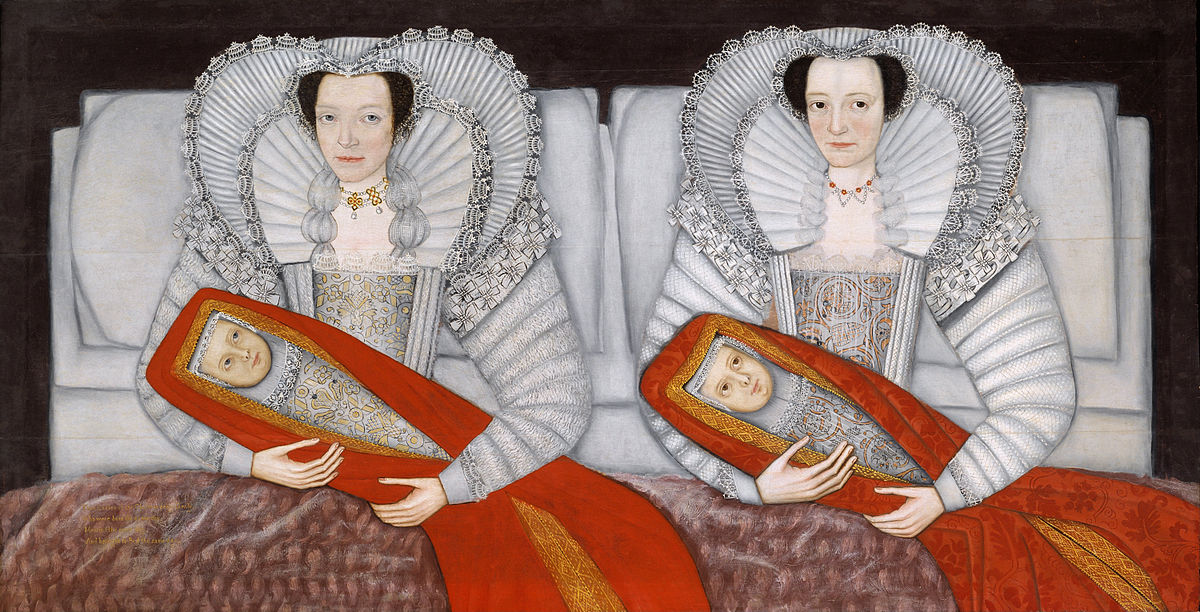 Two young women sitting up in bed, fully dressed, each holding an infant. The different coloured eyes of the ladies and children show that they are not identical twins. The babies are swaddled in red christening robes
