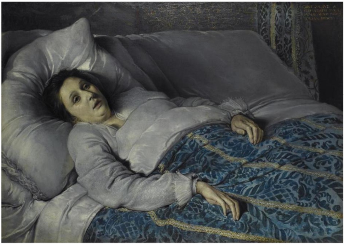 A brunette woman lying under bedclothes stares upwards. Her face has a greenish hue